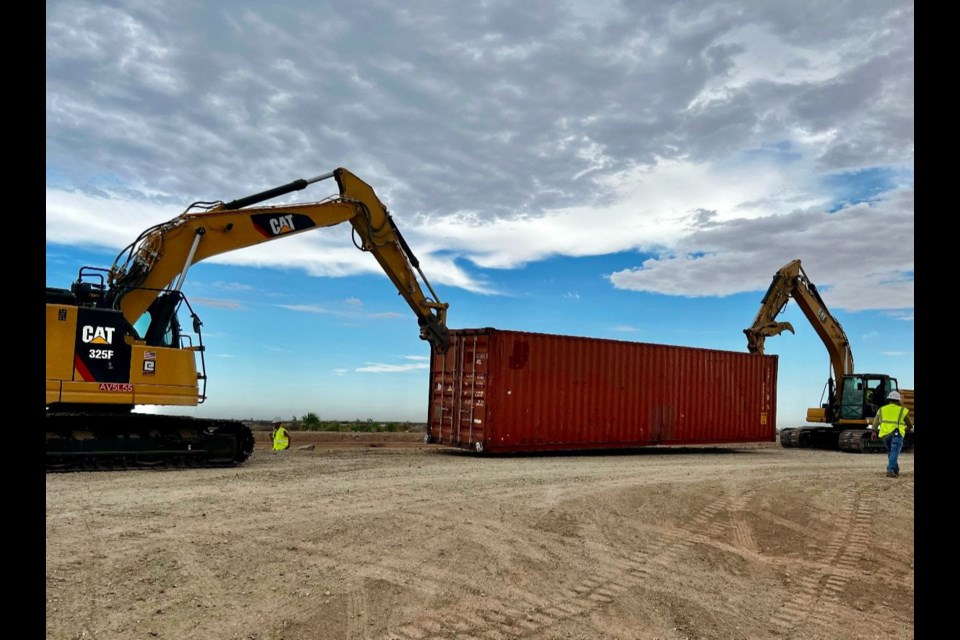 On Aug. 12, 2022, Gov. Doug Ducey issued an Executive Order directing the Arizona Department of Emergency and Military Affairs to immediately fill the gaps in the Yuma border wall. Fortifying the border will be 60 double-stacked shipping containers, reinforced with concertina wire at the top. The shipping containers will reach about 22 feet high. The state-owned, 8,800-pound, 9-by-40-foot containers will be linked together and welded shut. The panels of the border wall constructed during the Trump administration are 30 feet high.