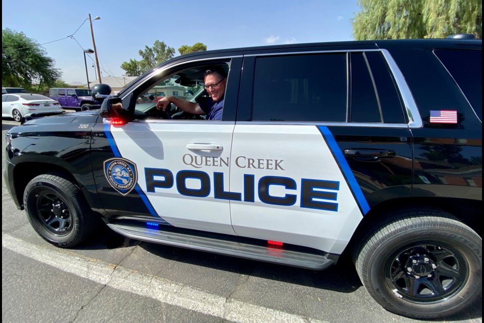 Queen Creek Police Chief Randy Brice sits inside the new Chevy Tahoe SUV police cruiser on Oct. 12, 2021.