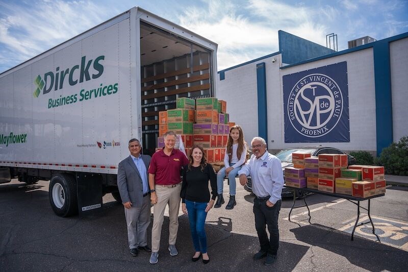 Dave Burns, of Burns Pest Elimination, gathered 20 local business owners to purchase over 1,900 boxes of cookies from local Girl Scout Eva Riley, of Troop 3886, as a donation to the Society of St. Vincent de Paul Phoenix.