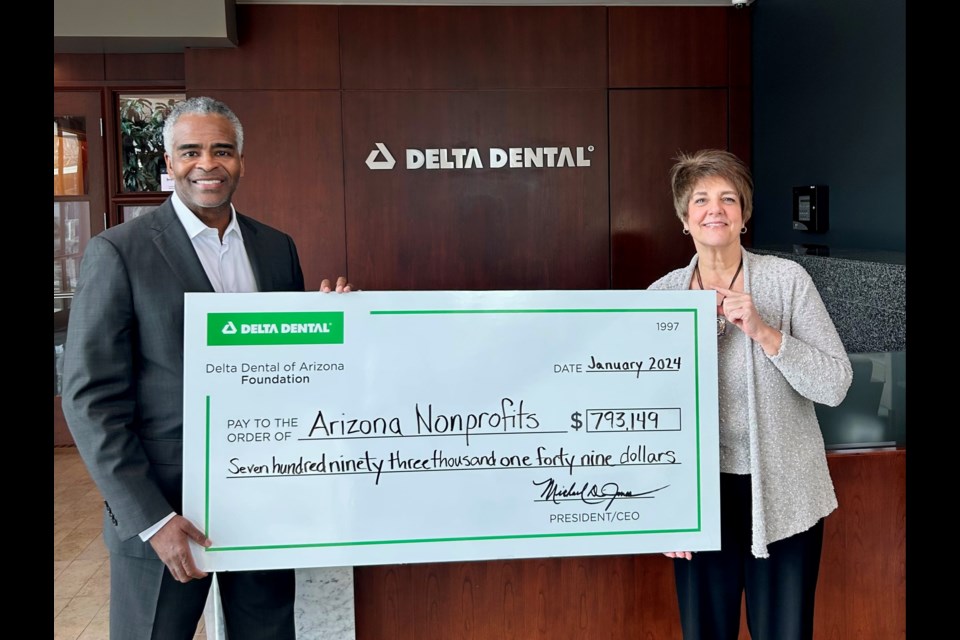 Michael Jones, president and CEO of Delta Dental of Arizona and president of the Delta Dental of Arizona Foundation, and Barb Kozuh, executive director of the Delta Dental of Arizona Foundation, making the 2024 check presentation.