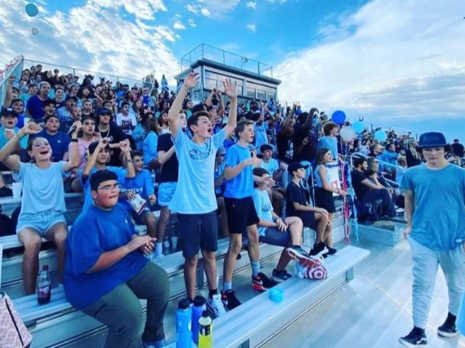 Spectators attend the first Crismon High School football game for the 2022-23 school year.