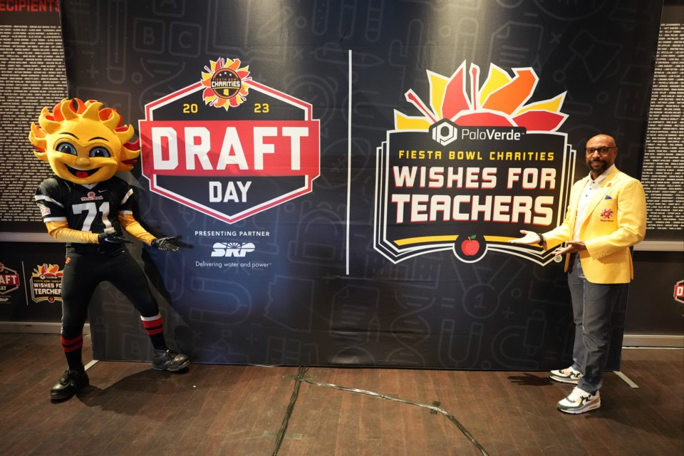 Fiesta Bowl Charities Executive Director and CEO Erik Moses helped present the 17 Queen Creek area teachers with $2,500 each during the Palo Verde Fiesta Bowl Charities Wishes for Teachers Draft Day. 