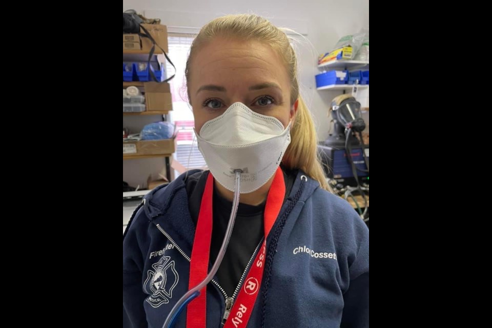 Firefighter Cossette, with the Queen Creek Fire and Medical Department, demonstrates how the face masks are tested.