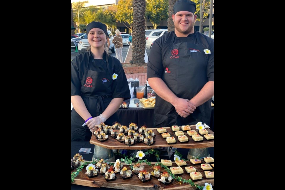 Two students, Sara Bohart and Kevin Fackrell, were selected to represent Queen Creek High School at the Harvest Moon Feast.