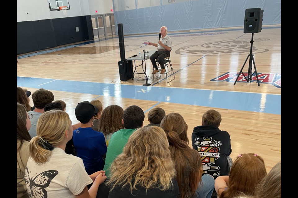 Dirk Van Leenen, 82, a Holocaust survivor and Mesa author, speaks to students at Crismon High School in Queen Creek.