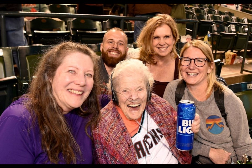 Myra Blaker (center) at the D-Backs home-opening game with (clockwise from left) daughter Laura, caregiver Paul Piperata and Hospice of the Valley social worker Renee Adams and nurse Kelly McGovern.