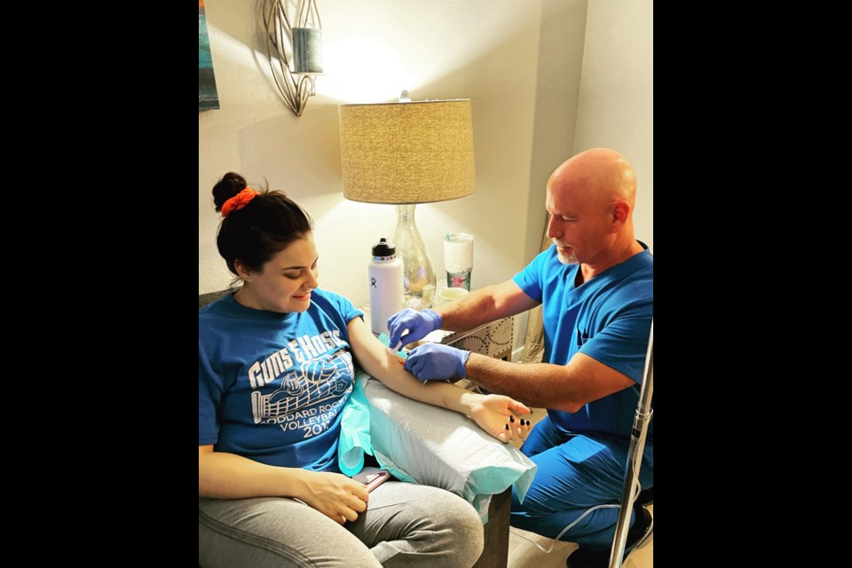 Niko Ferguson operates her mobile IV business iDripDuo out of Scottsdale with her husband Shon Ferguson, pictured here with a patient. The couple has been registered nurses for over 20 years and they decided to start their IV therapy business as a side hustle during the last few months of 2020.