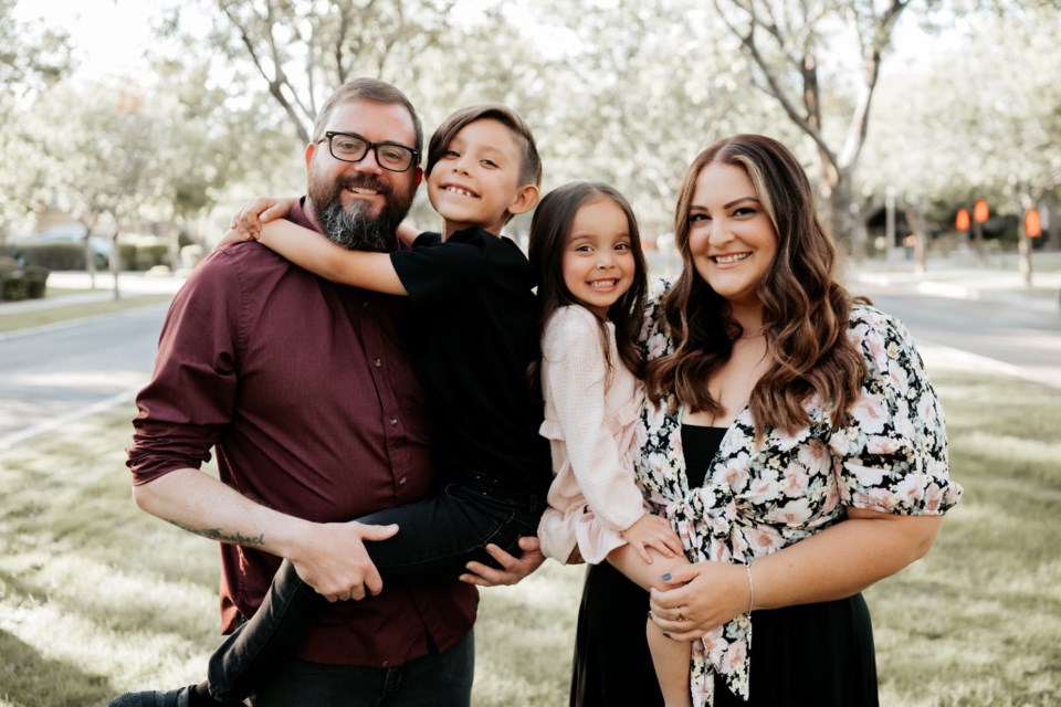 Liz Richardson, a local medical advocate mom, with her husband, Peter, and their two adopted children, Phoebe and Geo.