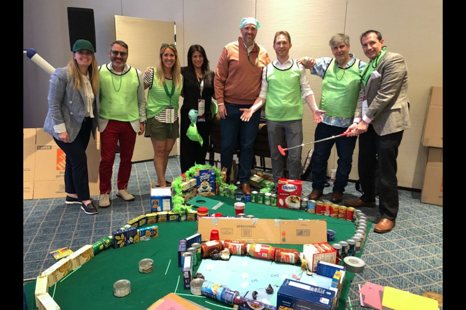 Biofrontera National Sales Training Manager Nancy Marigliano (dressed in black) participated in a corporate social responsibility team-building program where teams designed, constructed and played a mini golf course using canned and boxed food items that, upon completion, were donated to United Food Bank.