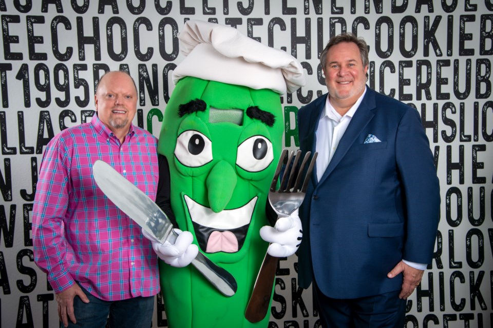 Mr. Pickle's Sandwich Shop President Dean Johnson and CEO Mike Nelson with Mr. Pickle himself. Mr. Pickle’s is now headquartered in Scottsdale and is coming soon to Queen Creek.