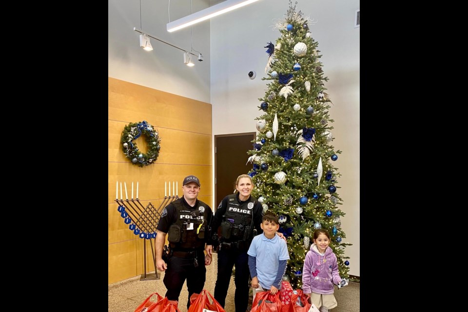 Queen Creek police officers have been busy delivering gifts this month to dozens of families throughout town as they participated in Target's Heroes and Helpers program, where they went shopping for children enrolled in the program. The officers cherished the opportunity to connect with kids while dropping off the gifts and seeing their faces light up with joy.