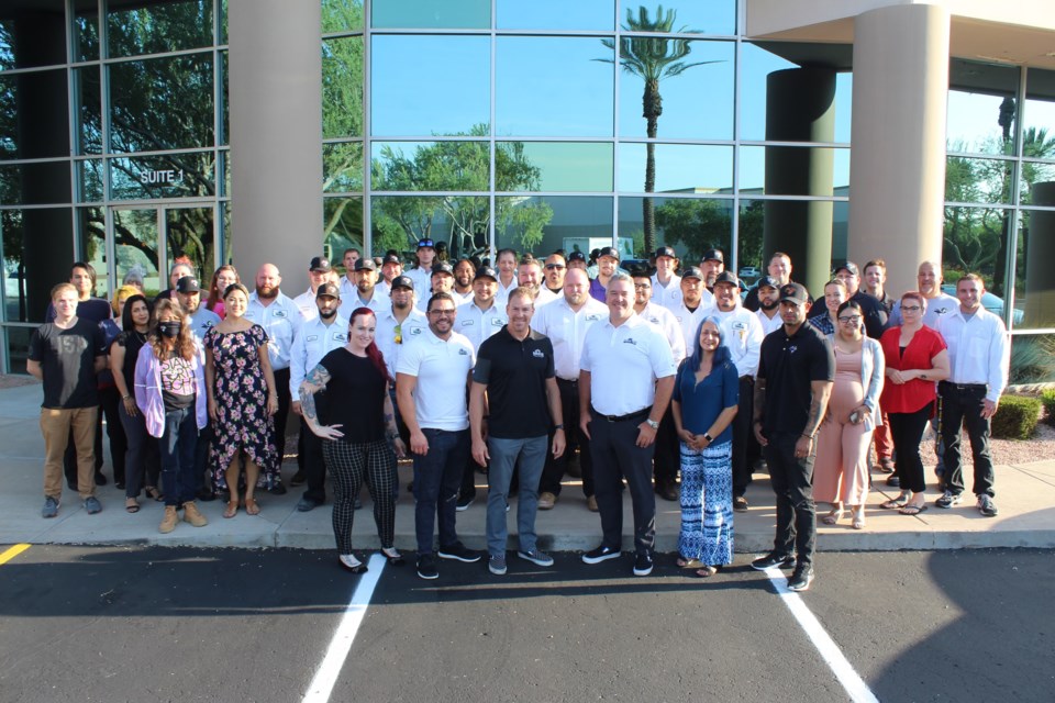 The team at Penguin Air, Plumbing & Electrical outside of its headquarters in Phoenix. Penguin was founded in 2011 by two born-and-raised Phoenix locals.