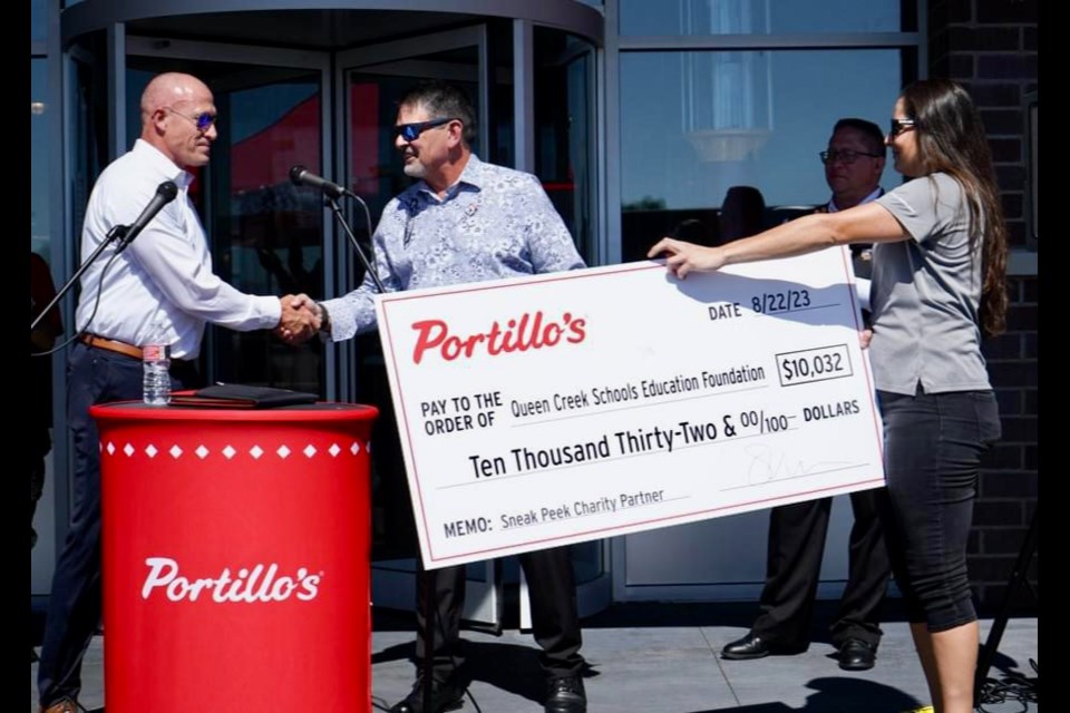 Queen Creek Unified School District and Queen Creek Schools Education Foundation officials thanked Portillo's for the $10,032 check they received by allowing them to be a sneak peek charity partner and said the money will go "toward teacher grants and student scholarships."