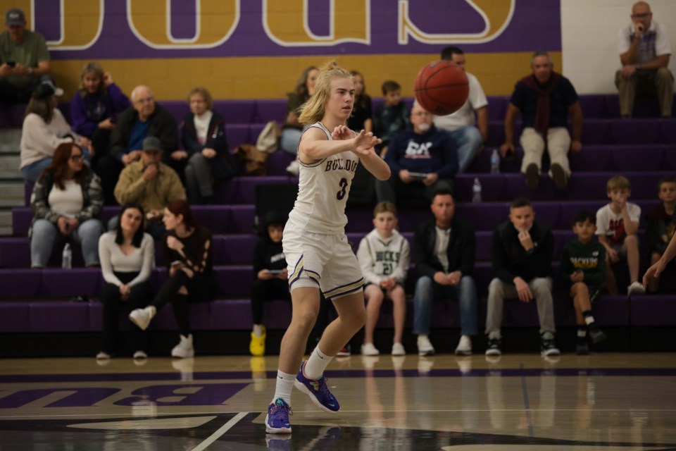 Guard Liam Bunker dishes the ball in last season’s game against Desert Ridge. The team recently played in the Section 7 tournament in Glendale, which hosted over 200 teams and hundreds more college coaches. 