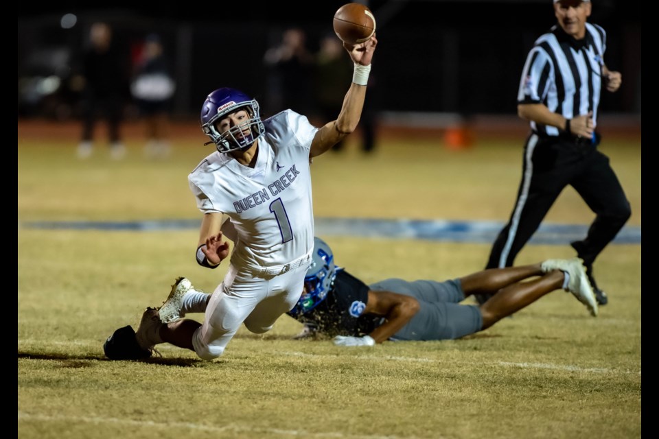 Sebastian Tomerlin goes for the throw. Queen Creek’s upset hopes in the first round of the playoffs, reserved for the state’s top eight football teams, ended in such fashion as the Bulldogs saw a halftime lead quickly dissipate in the opening minutes of the second half against Chandler on Nov. 26, 2021. 