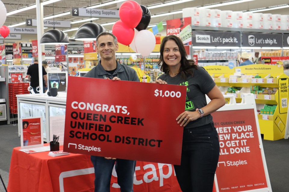 Scott Urich, general manager of the Staples store, presented the Queen Creek Unified School District with a $1,000 gift card to Staples on June 14, 2023. Educators and schools are encouraged to enroll in the Staples classroom rewards program. Parents can enroll in the Staples rewards program and get 5% back to give to teachers and schools.