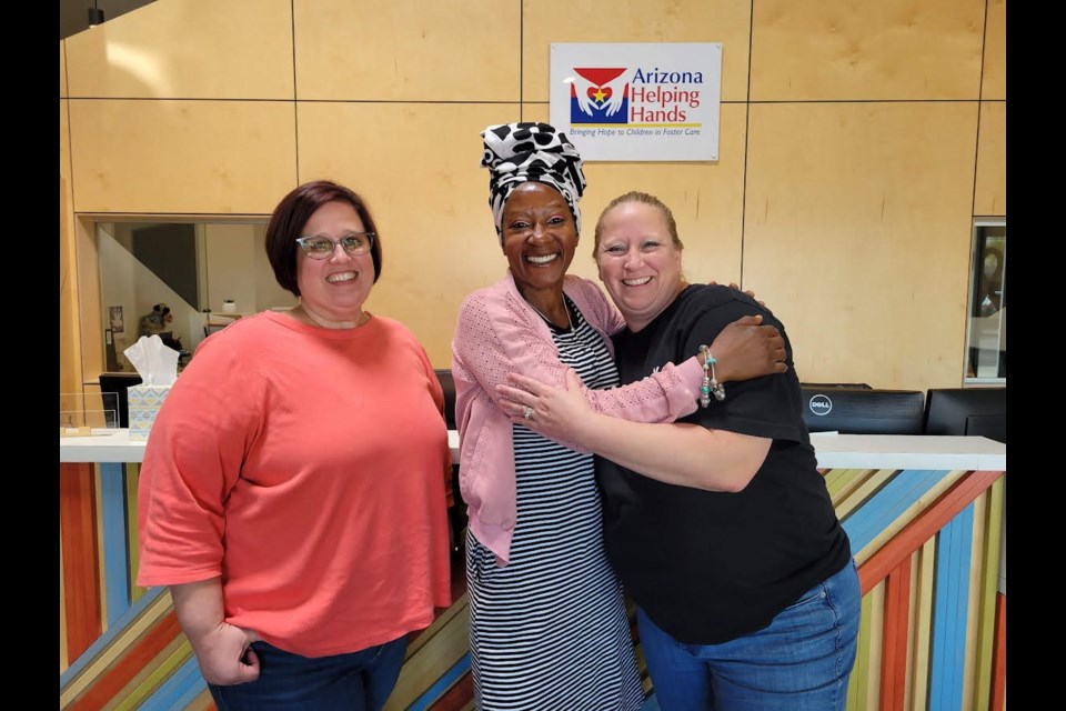 Tracey Christian, center, has been a foster mother for 25 years and relies on agencies like Arizona Helping Hands to provide basic essentials for children in her care.