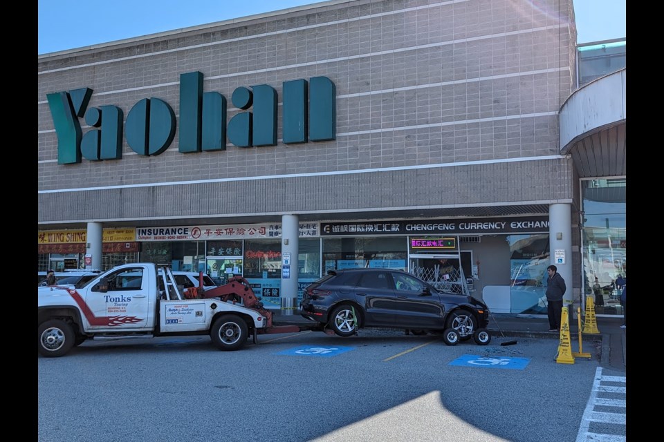 A Porsche drove into a currency exchange shop at Richmond's Yaohan Centre.