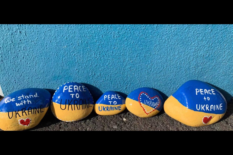 Richmond community activist Karina Reid and her family members spent few days painting the rocks with Ukraine flags. 