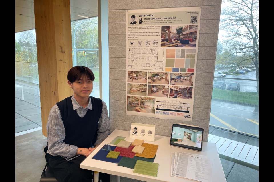 KPU Wilson School of Design student Larry Brian with his interior design for a school for the deaf.