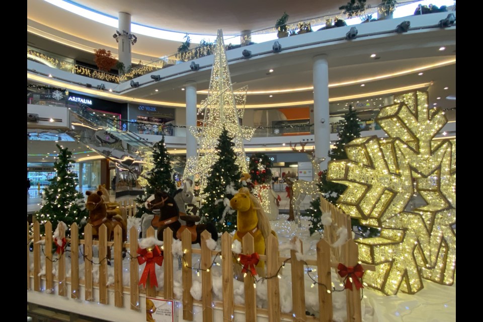 The exhibition features a 15-feet-tall Christmas tree, lighted sparkling reindeer, and giant gingerbread men. Photo by Nono Shen