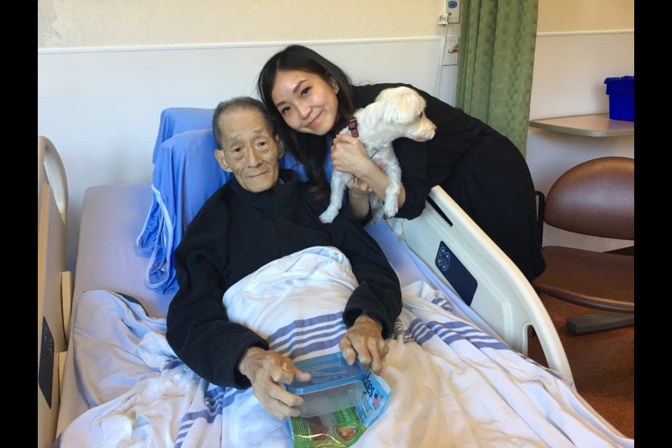 Amy Tsai (right) with her father at the hospital in 2019.