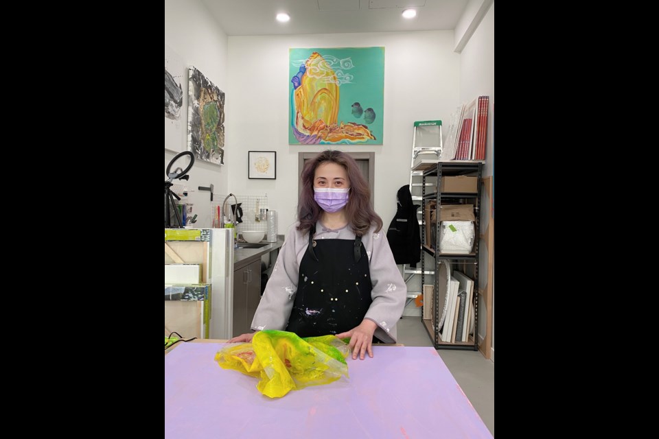 Fanny Bok Yin Tang is at her art studio. 