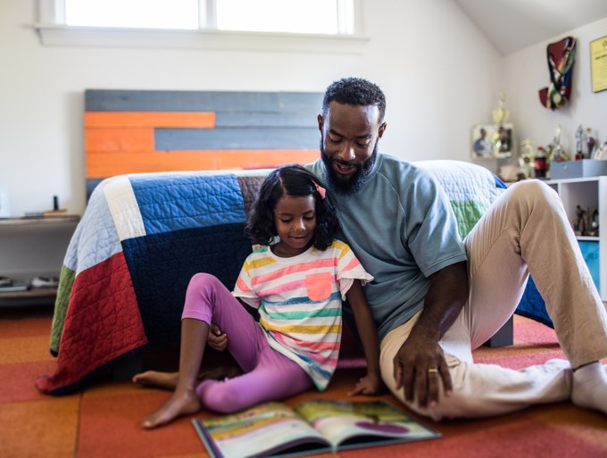 Daughter and Father reading together