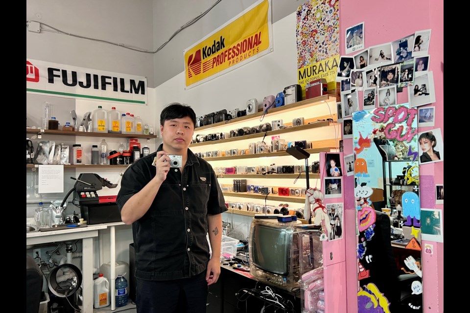 The Point and Shoot Club in Aberdeen Square was founded by Kevin Shen to provide a space for camera enthusiasts.