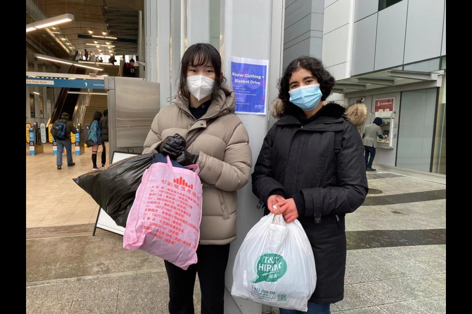  Sarah Lin (left) and Rania El Kissay were collecting donations this afternoon at Richmond-Brighouse Canada Line station. 