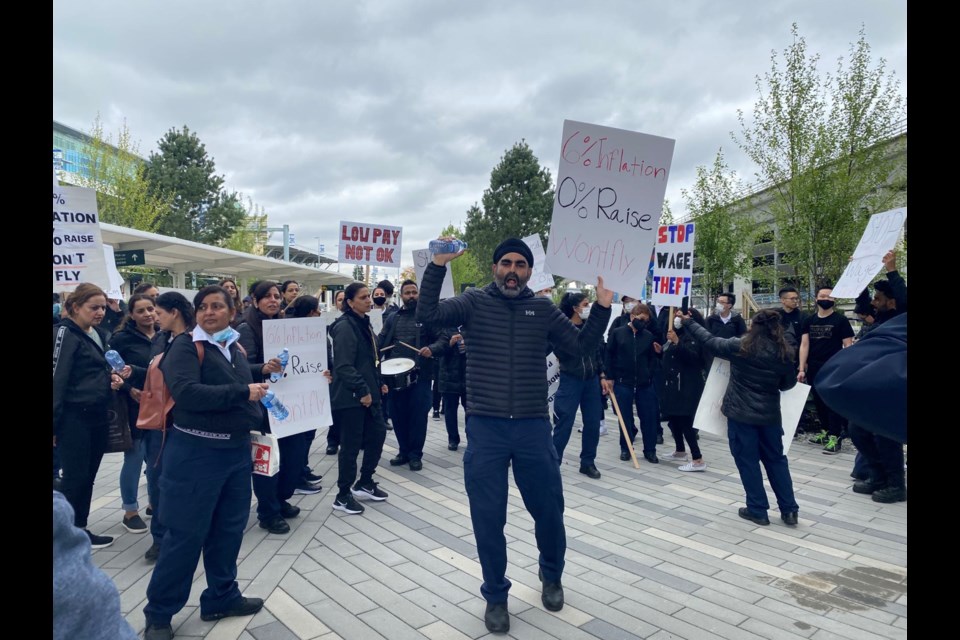 Dozens of airport screening officers gathered outside Vancouver International Airport Monday, calling for better pay and less stressful working conditions.