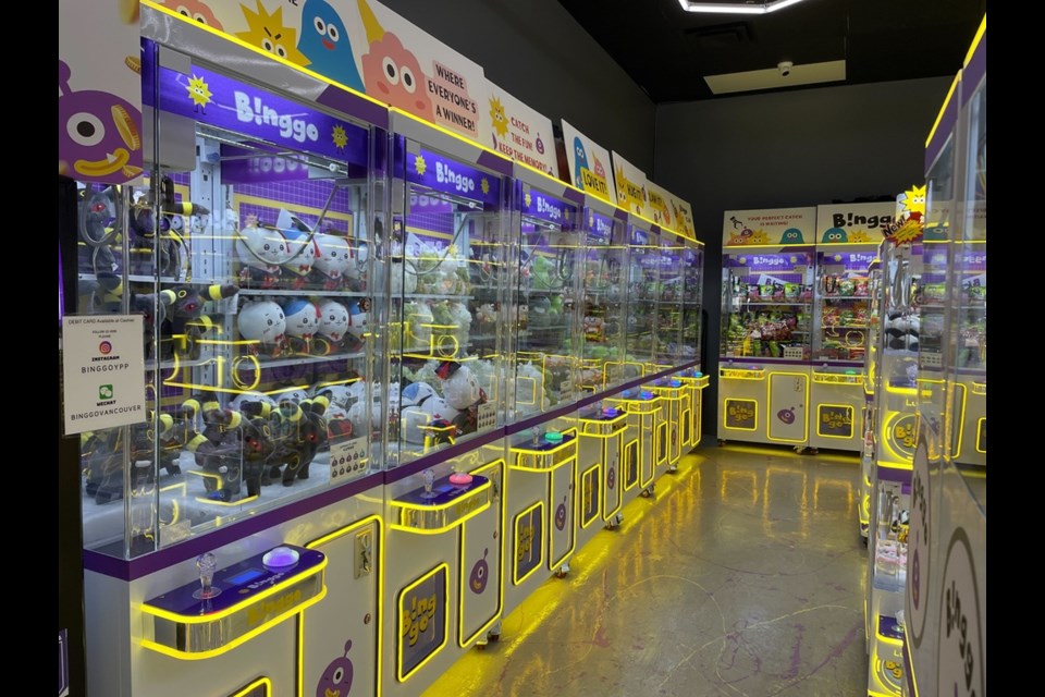Several rows of claw machines with stuffed animals and keychains at Richmond's newest Binggo Purple store.