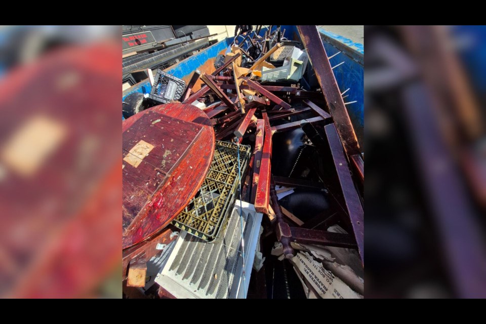 Many decor, structures and memorabilia from the Buck and Ear were being thrown away into a dumpster.