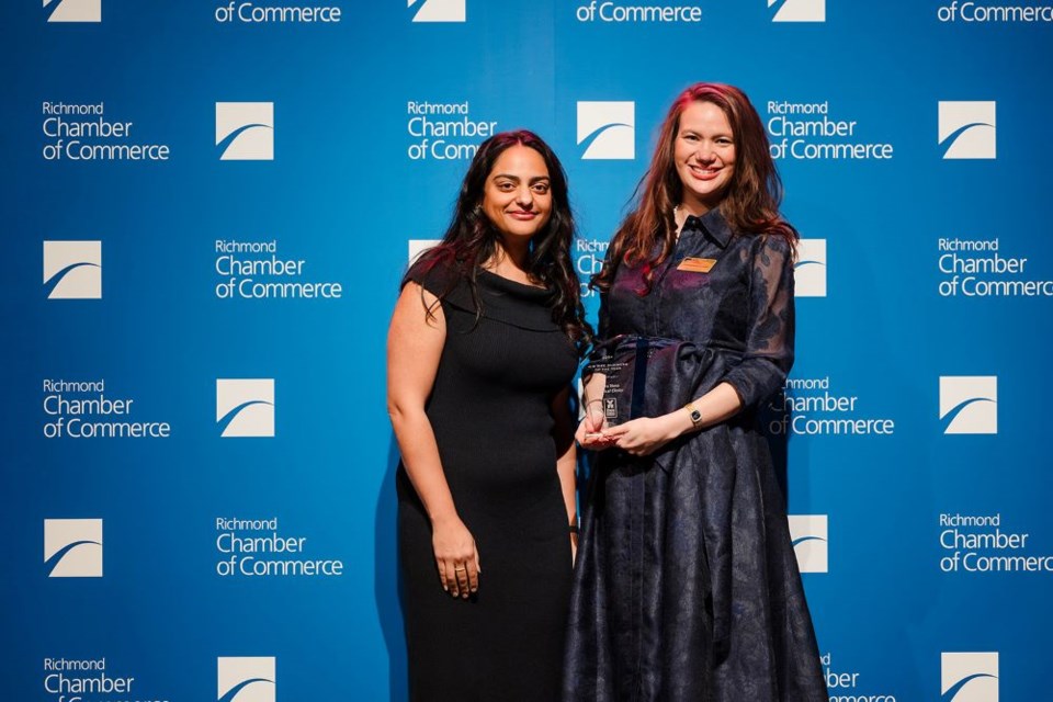 dr-julie-wilson-right-accepts-the-award-for-terra-nova-medical-clinics-presented-by-amina-valli-hasham-from-scotiabank-left