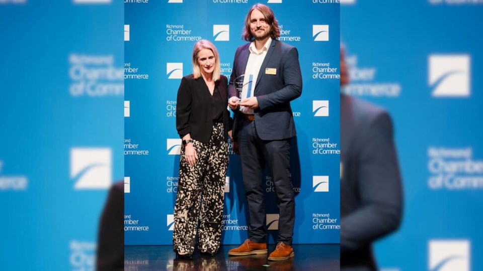 josh-mclean-right-accepts-the-green-business-of-the-year-award-presented-by-theresa-rawle-from-vancouver-fraser-port-authority-left-blurred