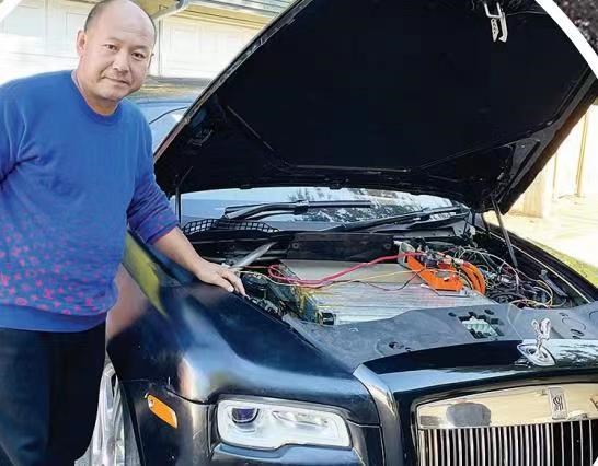 Vincent Yu and his converted Rolls-Royce car. 