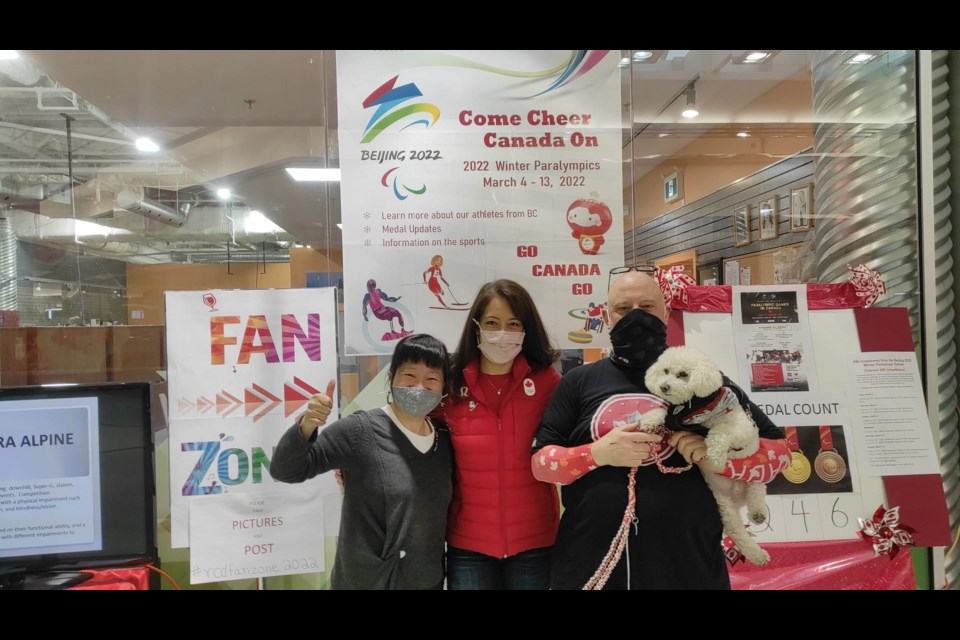 RCD's Ella Huang (left) and Dave Thomson (right) with Coun. Alexa Loo at RCD's Paralympic fan zone on Monday