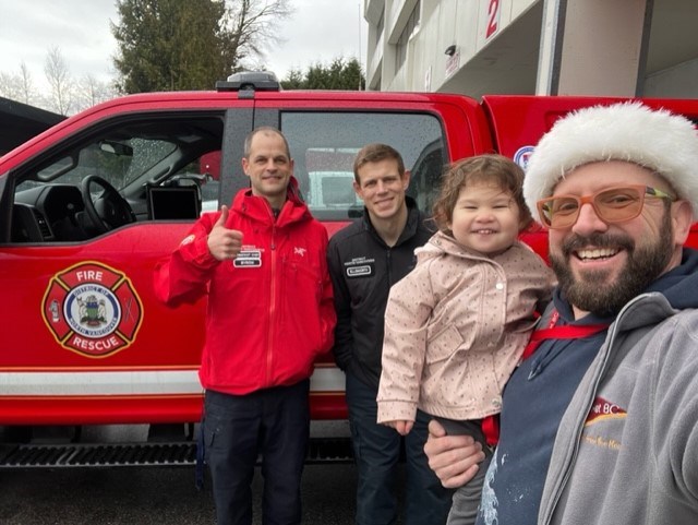 Greg Ould (right) handed over more than $50,000 worth of winter gear to members of the North Shore Search and Rescue