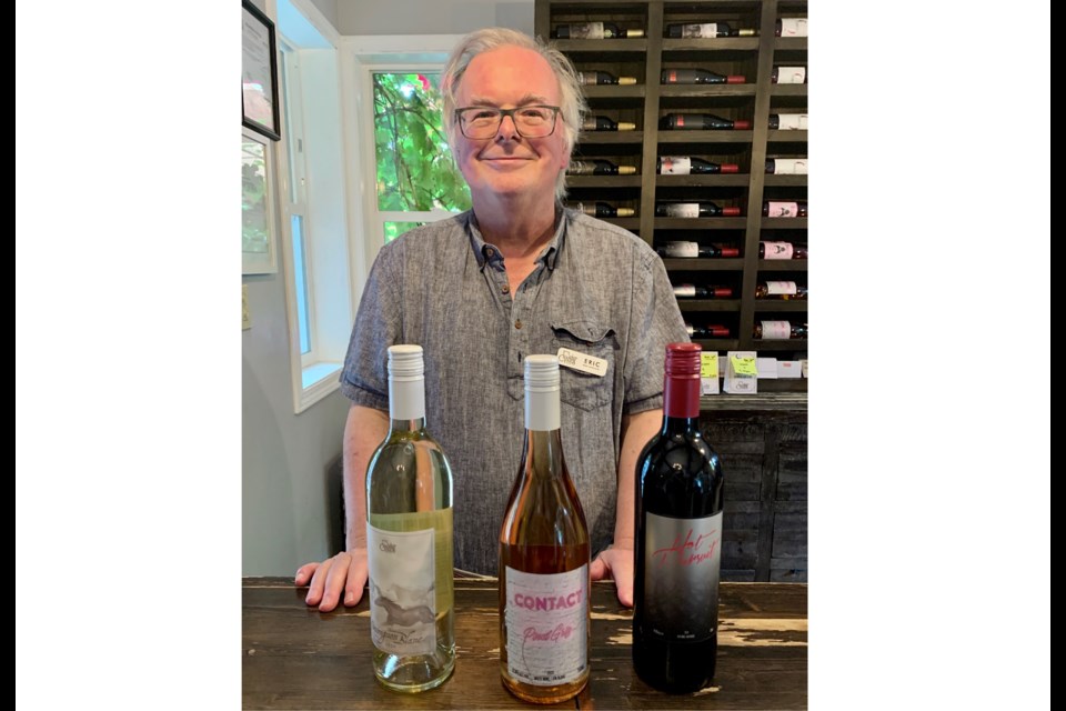 Eric Urqhart, Country Vines Tasting Room Sommelier displays today’s recommended wines: Sauvignon Blanc, Pinot Gris Rosé, and Hot Pursuit, a delicious red blend.