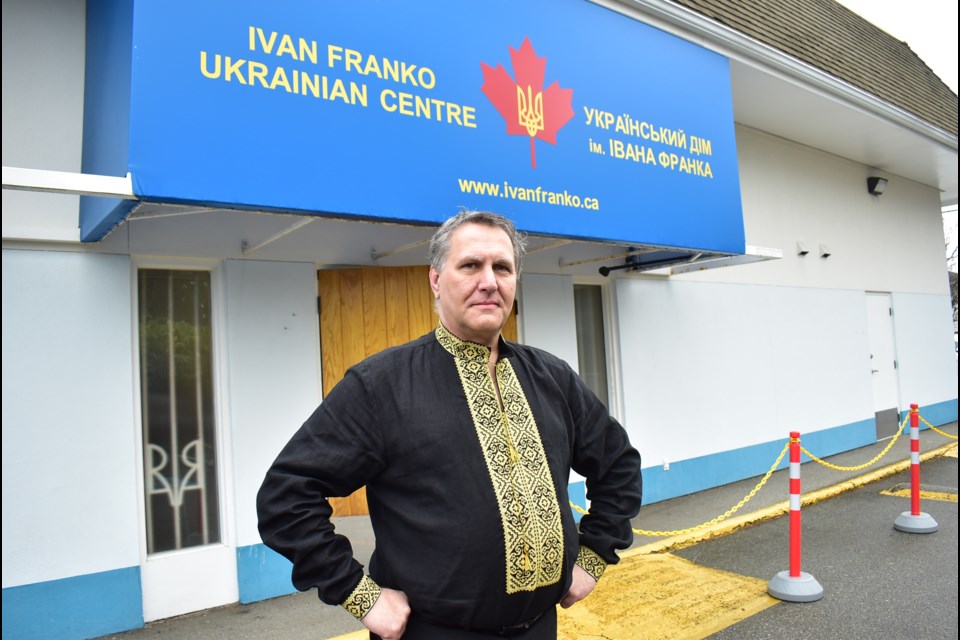 Eugene Lupynis, a board director for the Ukrainian Community Society of Ivan Franko in Richmond, wearing a traditional Ukrainian shirt, called a Vyshyvanka, stands outside the society's community centre.