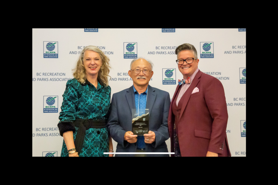 Alan Sakai (centre) accepts his award from Rebecca B Tunnacliffe (left), BCRPA CEO, and Donnie Rosa, BCRPA president.