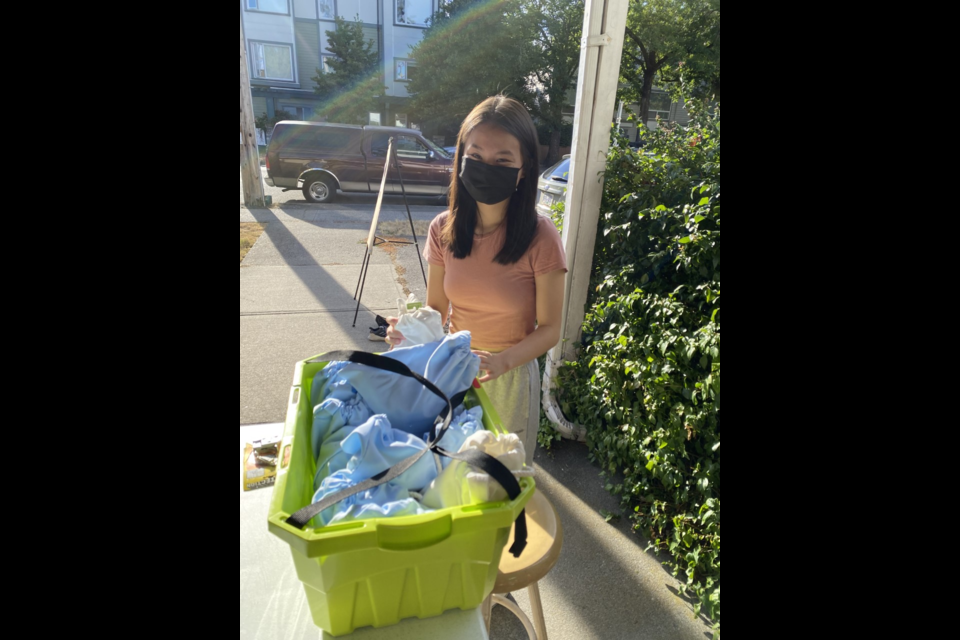 Eden Wu, with her home-made bags for guests at the St. Alban's community meal