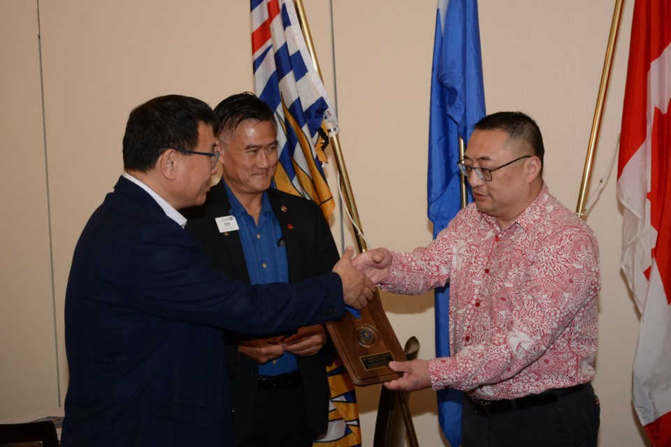 Louis Huang received an award from the Rotary Club of Richmond. 