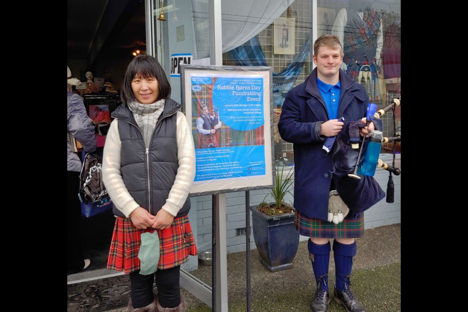 SOS Children's Village thrift store manager Yasmin Tang (left) with piper Kyle Banta