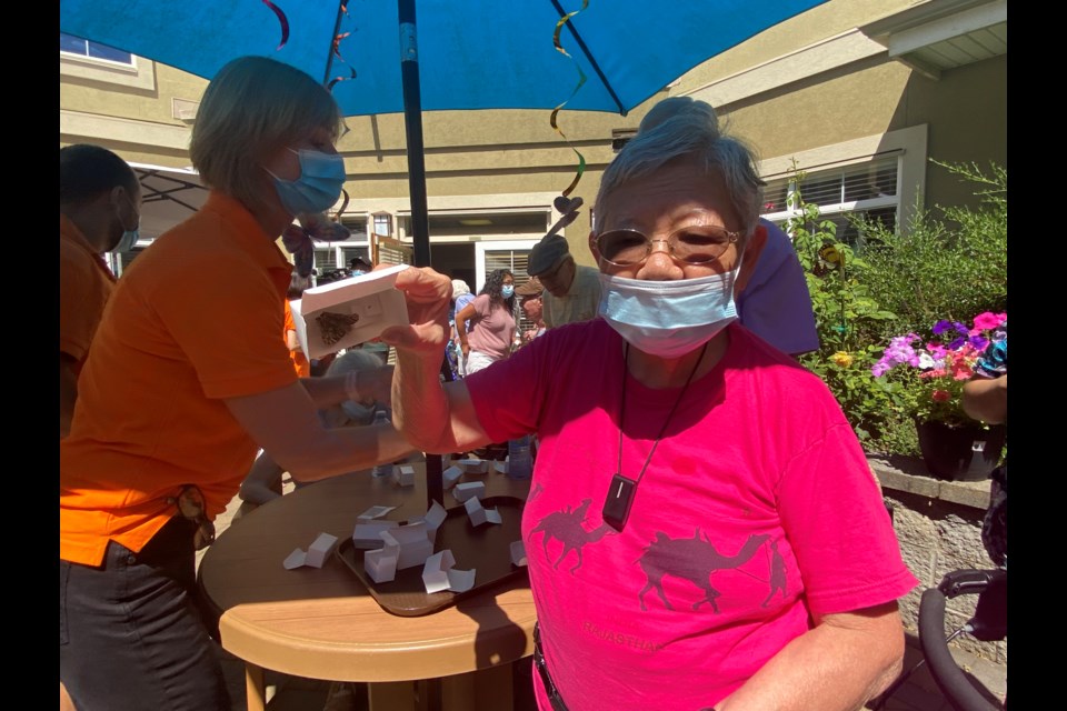 A resident was holding a butterfly. 