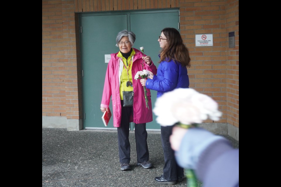 Grade 11 and 12 students from Hugh Boyd's social justice class performed a flower flashmob on Blue Monday to cheer up Richmond seniors