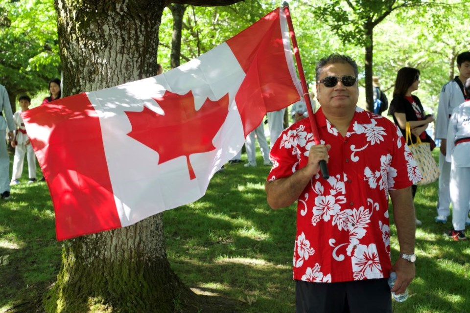 Canadian flags were flying at the Steveston Salmon Festival/Canada Day parade on July 1, 2025.