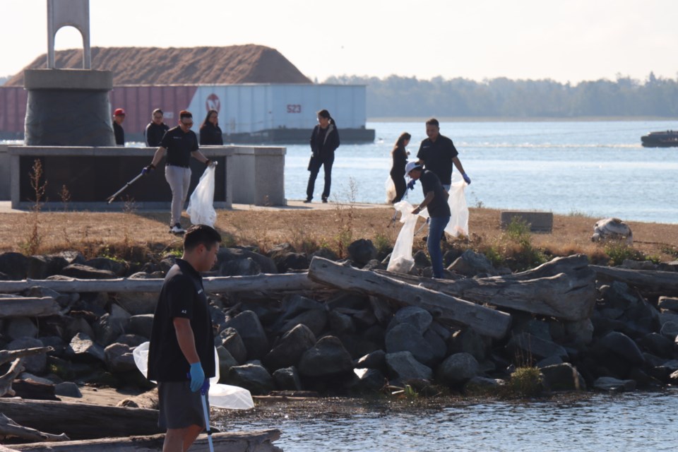 Around 30 members of Richmond's Chamber of Commerce and their families volunteered to clean up Garry Point Park last Saturday.