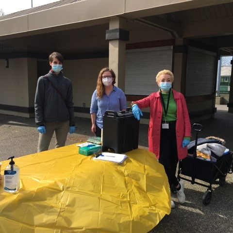 OARS program coordinator Morgan Meloche (left) with staff Kendra MacDougall (centre) and Caitlin van der Have during the 200th day of lunches served at the park since COVID-19 hit.