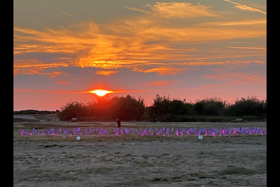 Purple flags at Garry Point Park marking 1,455 lives lost to the opioid crisis within the first seven months of 2023.